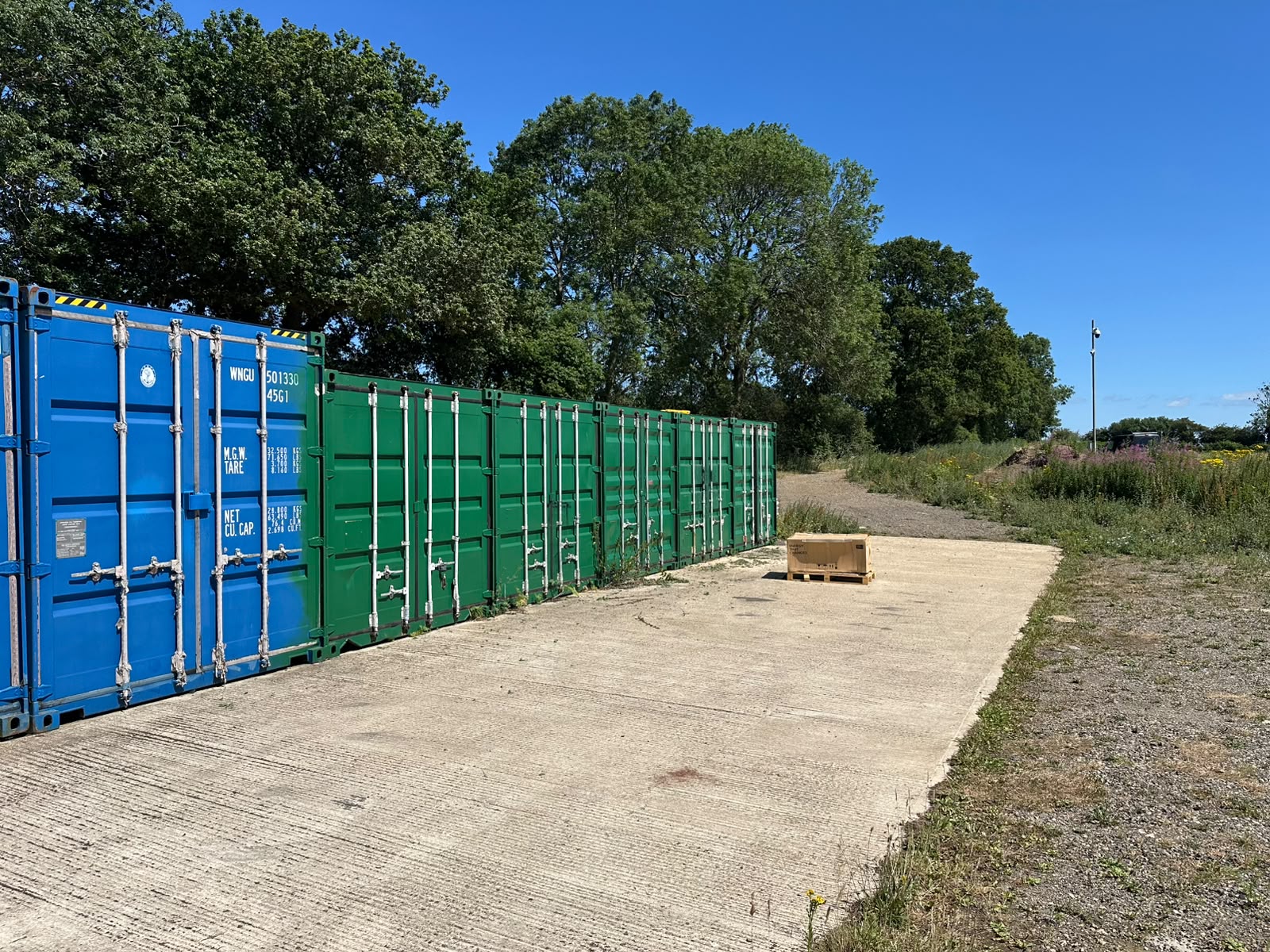 Storage containers on a concrete hardstanding at Grovelands Business Park near Northampton and Daventry