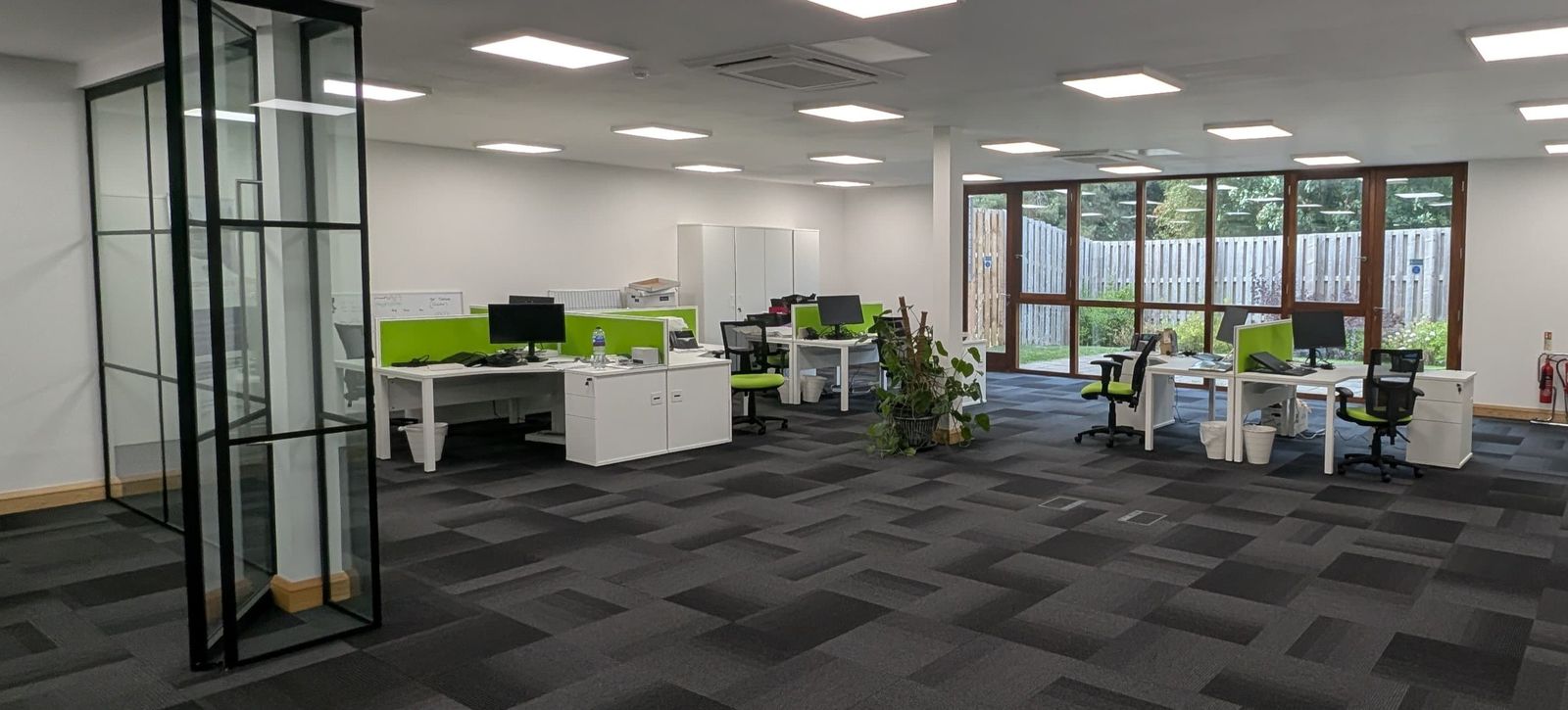 Flexible office space to let in Northamptonshire — desk area with garden view at Grovelands Business Park