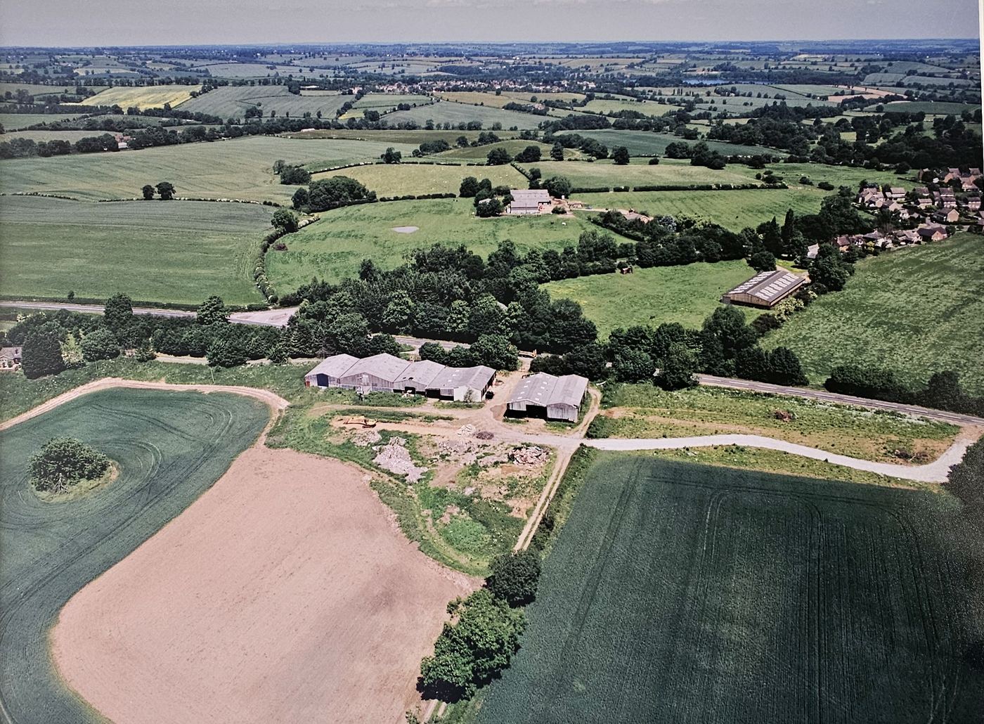 Aerial photograph of the original derelict farm buildings at East Haddon before conversion